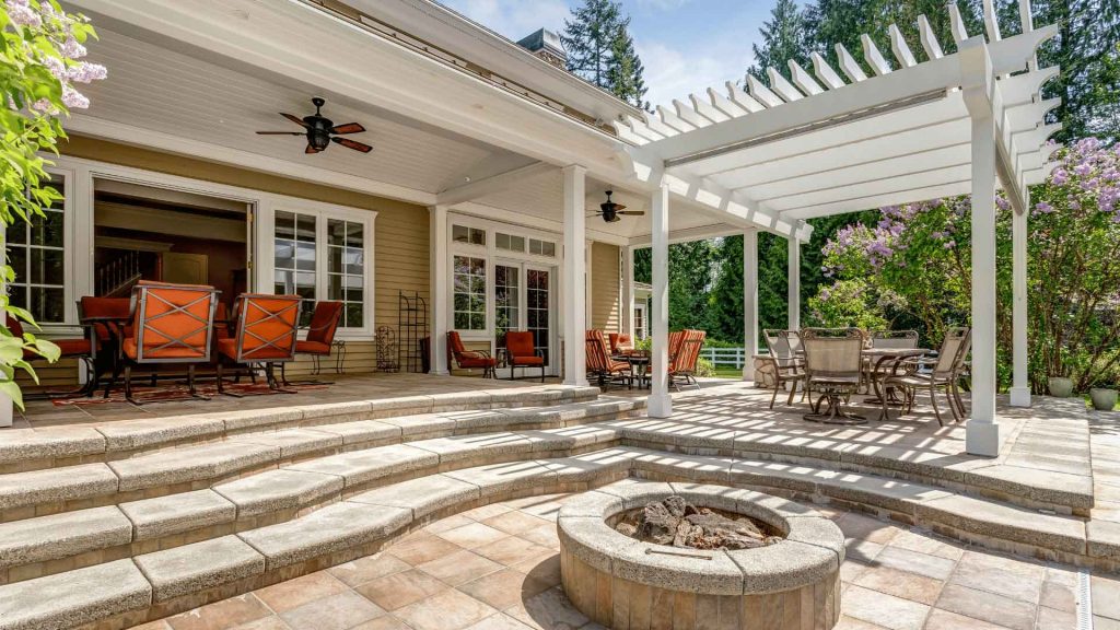 Covered patio with pergola, outdoor seating and a fire pit